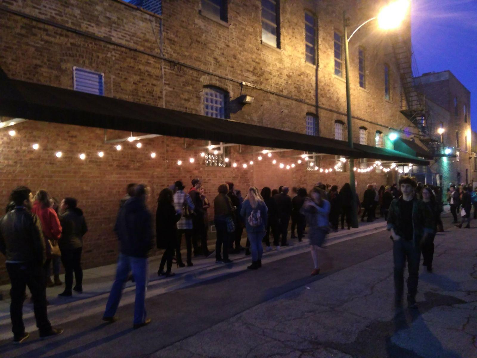 People waiting in the line to enter exhibition